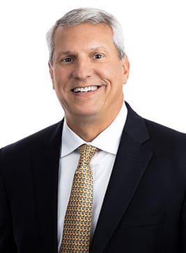 A photograph of Mark Henderson, Executive Vice President of PCI-GS